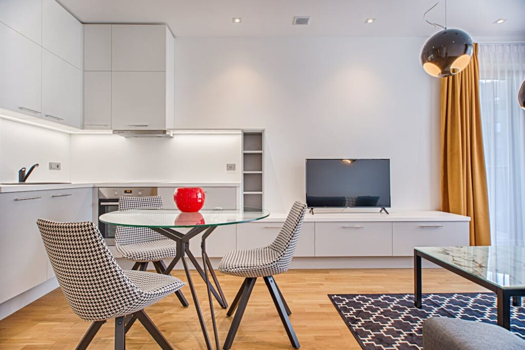 Clear Glass-top Table Near Flat Screen Television